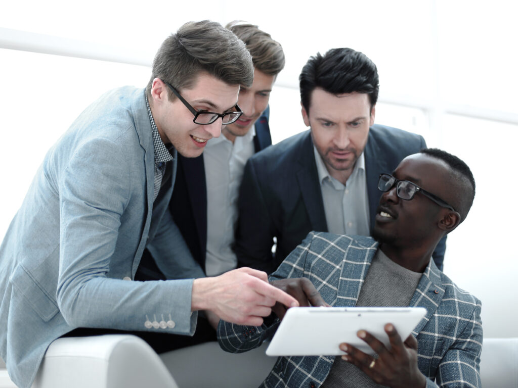 business team discusses the information using a digital tablet